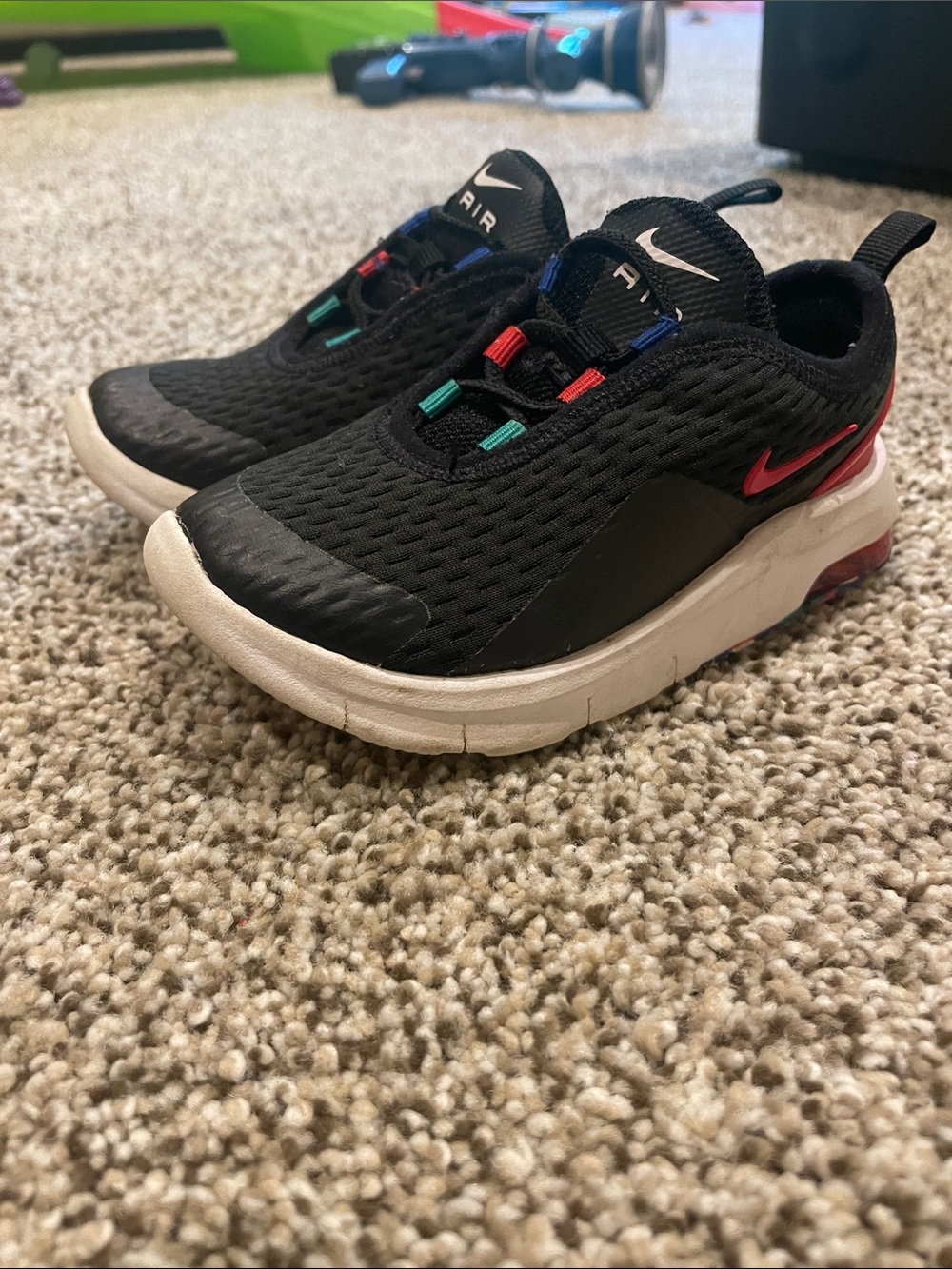 Nike Black Kids Slip-On Sneakers with Red Swoosh and Multicolor Eyelets